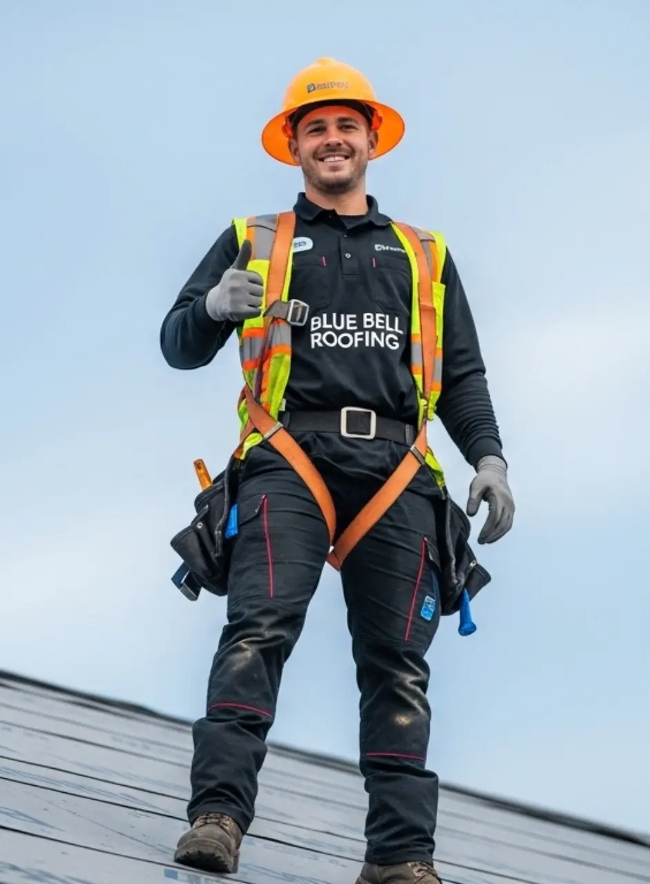 A happy Blue Bell Worker after completing an roofing project